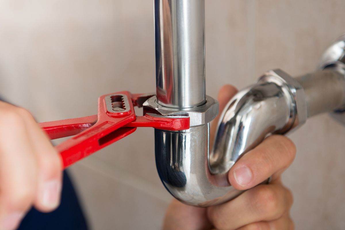A plumber from Zest fixing pipe