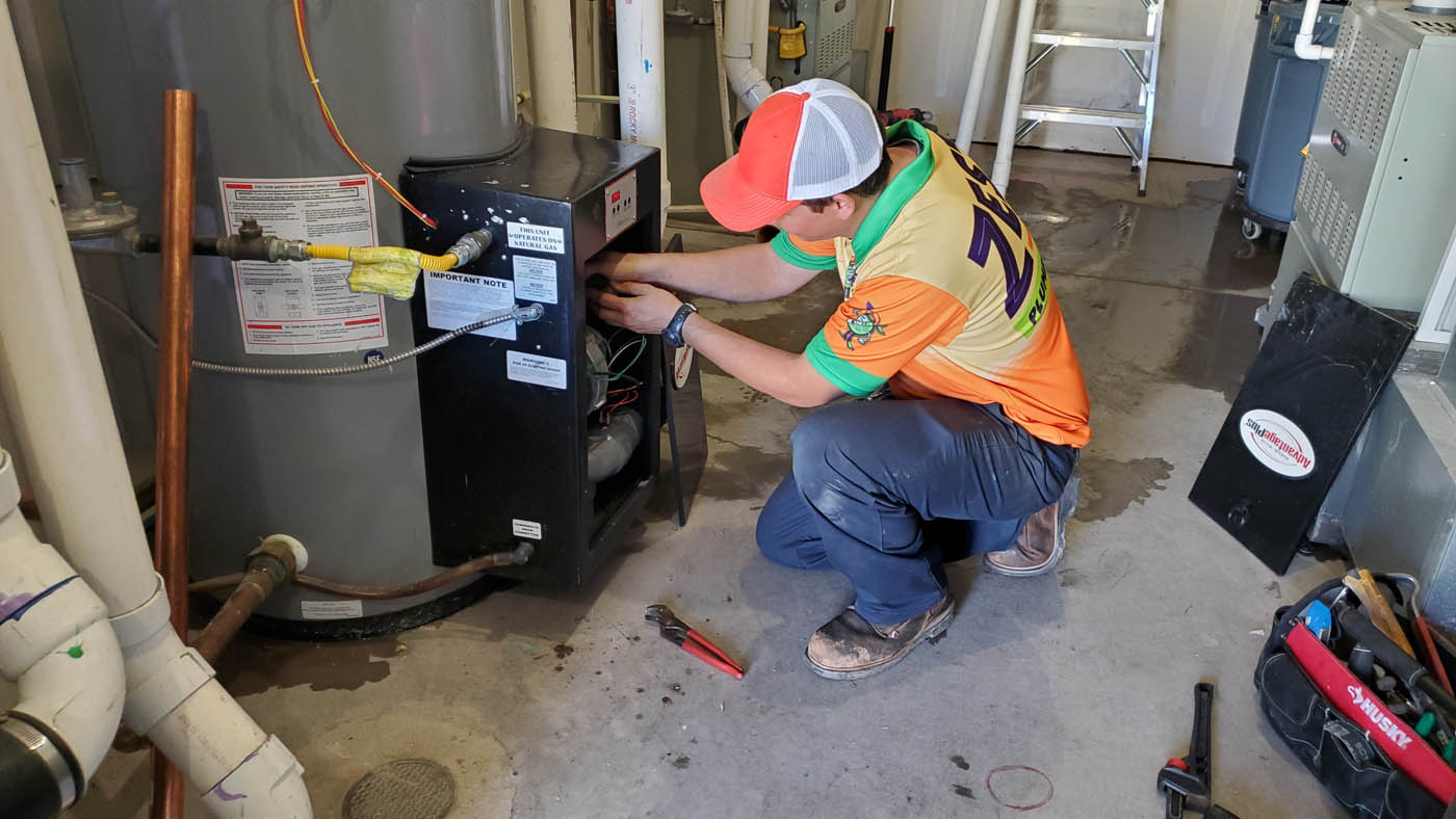 A Zest Plumbing & Drain technician working on plumbing installation in Scottsdale, AZ.