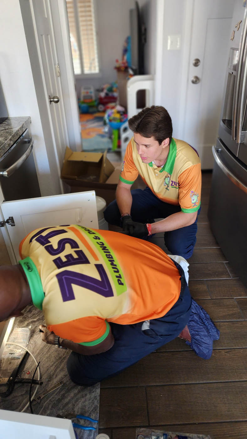 Two Zest Plumbing & Drain Scottsdale technicians providing plumbing services for a residential property.