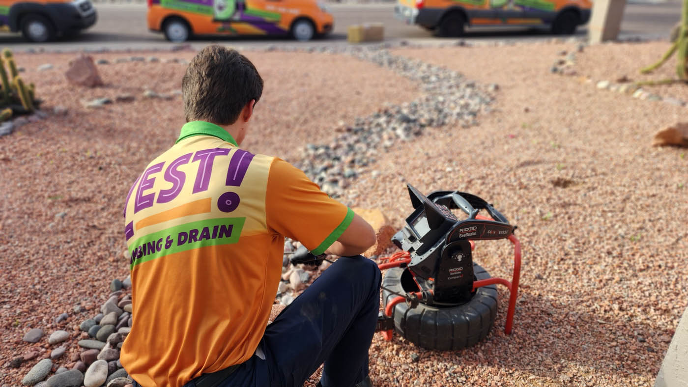 A Zest Arizona technician working on a sewer and sump pump service.