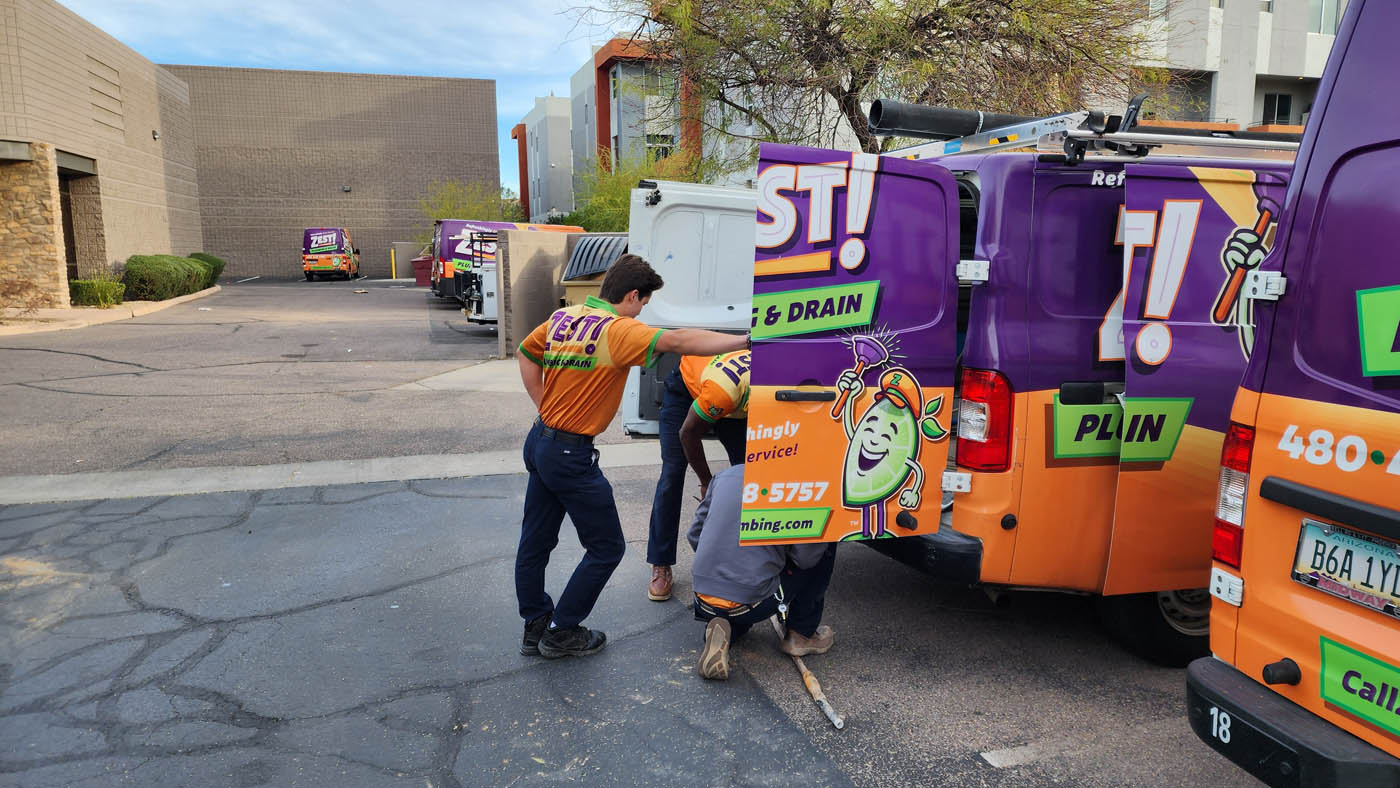 A group of Zest Plumbing & Drain technicians getting equipment for drain cleaning services in Scottsdale, AZ.